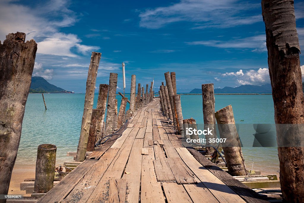 "wooden pathway into the sea. pulau langkawi, malaysia."